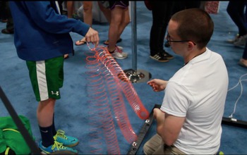 two young men using wires at the USA Science and Engineering festival